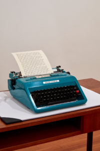 Deborah Rundle, A Dream Seems Like a Dream, 2018 (detail). Portable Olivetti typewriter, paper, desk and desk blotter. Photo by Sam Hartnett.