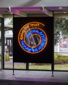 PĀNiA!, The True Artist Helps the World by Asking for Trust (After Bruce Nauman), 2019 (install view). LED neon, acrylic, fixings. Courtesy the artist, Te Tuhi and Mokopōpaki, Auckland. Photo by Sam Hartnett.