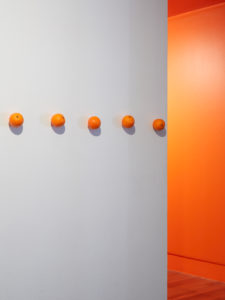 PĀNiA!, Plastic Orange Band, 2019 (install view). Fake plastic oranges, fixings 16 pieces. Courtesy the artist, Te Tuhi and Mokopōpaki, Auckland. Photo by Sam Hartnett.