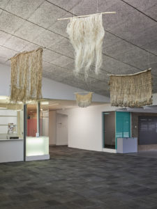 Arapeta Ashton, Māwhitiwhiti, 2019 (install view). Māori garment collection, rākau, tī kouka, harakeke, kiekie. Photo by Sam Hartnett.