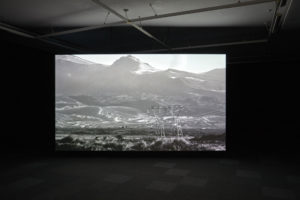Shannon Te Ao, With the sun aglow, I have my pensive moods, 2017 (installation view). Two channel video, colour and sound cinematography by Iain Frengley. Commissioned by Edinburgh Art Festival and Te Tuhi, Aotearoa New Zealand. Photo by Sam Hartnett, courtesy of Mossman, Wellington.