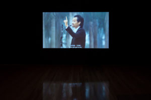 Hu Xiangqian, Speech at the edge of the world, 2014 (installation view). Single channel HD video 12 mins 31 secs. Courtesy of Long March Space, Beijing. Photo by Sam Hartnett.
