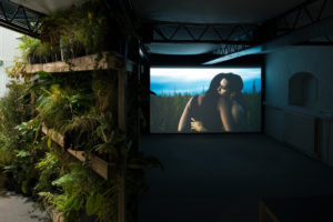Shannon Te Ao, With the sun aglow, I have my pensive moods, 2017 (install view). Two channel video, colour and sound cinematography by Iain Frengley. Commissioned by Edinburgh Art Festival and Te Tuhi, Aotearoa New Zealand. Courtesy of Mossman, Wellington. Photo by Johnny Barrington.