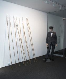 Matthew Cowan, The terminalia of funny-land, 2014 (installation view). Performance objects, framed digital giclee print original held at the Auckland Council Archives. 16mm film work.