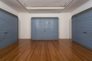 Luke Willis Thompson, Untitled, 2012 (installation view). Three garage doors relating to the death of Pihema Cameron, 26 January 2008. Courtesy of the artist and Hopkinson Mossman, Auckland. Commissioned by Te Tuhi, Auckland. Photo by Sam Hartnett