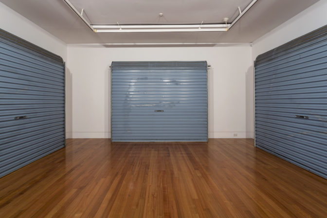 Luke Willis Thompson, Untitled, 2012 (installation view). Three garage doors relating to the death of Pihema Cameron, 26 January 2008. Courtesy of the artist and Hopkinson Mossman, Auckland. Commissioned by Te Tuhi, Auckland. Photo by Sam Hartnett