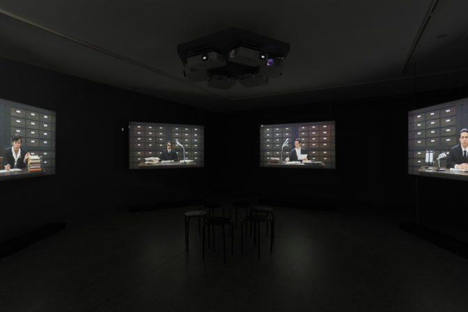 Andrea Geyer, Criminal Case 40/61: Reverb, 2009 (installation view). Six channel video installation HD video, sound, six stools 52 mins. Courtesy the artist. Photo by Sam Hartnett.
