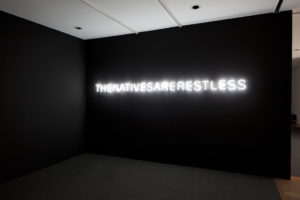Newell Harry, The natives are restless, 2006-2012 neon, helvetica neue lite (snow white), timer. Courtesy of the artist and Roslyn Oxley 9 Gallery, Sydney. Photo by Sam Hartnett.