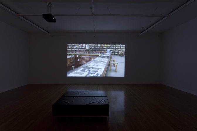Lisa Crowley, The Reading Hall, 2011 (installation view). Dual channel digital video, 16mm B/W film transferred to Blu-ray courtesy of Jensen Gallery, Auckland and McNamara Gallery, Whanganui. Photo by Sam Hartnett.