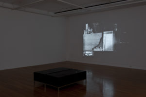 Lisa Crowley, The Reading Hall, 2011 (installation view). Dual channel digital video, 16mm B/W film transferred to Blu-ray courtesy of Jensen Gallery, Auckland and McNamara Gallery, Whanganui. Photo by Sam Hartnett.