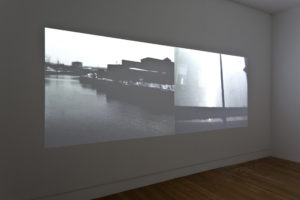Peter Wareing, Utility Black, 2011 (installation view). Dual channel digital video, 30min/loop. Photo by Sam Hartnett