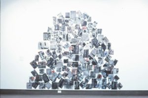 Richard Killeen, Burial Mound, 1992 (installation view). Acrylic and collage on aluminium, 120 pieces. 2700mm x 3200mm approx. Collection of the artist.