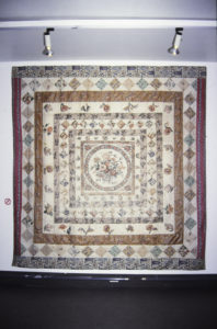 Bedcover, 1880-90 (installation view). Cotton patchwork & applique. 2660mm x 2590mm.