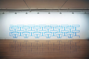 Simon Morris, Manganese Blue Line, 5 hours 57 minutes, 2009 (installation view). Water based enamel on wall. Courtesy of Two Rooms, Tāmaki Makaurau Auckland.