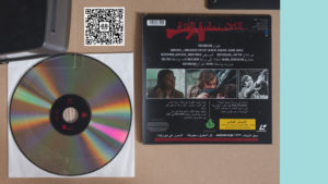Jem Noble, adoptthenewphilosophy (100mph Bitch), 2016 (detail). Mock Laser Disc release (Arabic), side 2/back cover; with Will Black (via Upwork). Commissioned by Te Tuhi, Tāmaki Makaurau Auckland. Photo by Sam Harnett.