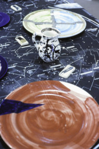 Rick Pearson, A culinary model of the universe, 1993 (detail). Hand painted dinner set and mixed media.