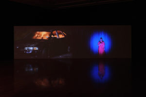 Christopher Ulutupu, What’s the worst you could do?, 2021 (installation view). Two-channel HD video, sound. 10 mins 48 secs. Cinematography by Haz Forrester. Sound & camera assist by Kane Laing. Commissioned by Te Tuhi, Tāmaki Makaurau Auckland. Photo by Sam Hartnett.