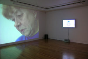 Raakel Kuukka, Drummer, 2003 (installation view). Two-channel DVD video. Courtesy of the artist.
