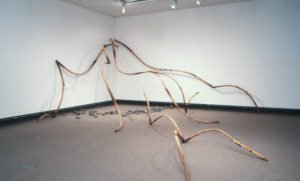 Chris Booth, Wave, Manukau Harbour, 1986-7 (installation view). Kanuka, bronze, basalt, epoxy, fibreglass.