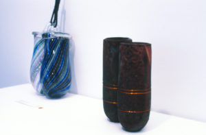 Peter Viesnik, Latticino Hanging Vases (left). Mixed media. Penny Evans, The Wires That Twine (right). Mixed media.