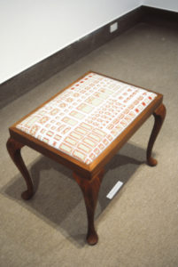 Monique Redmond, Household Words, 1994 (installation view). Embroidered footstool.