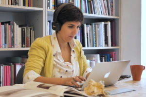 Curator-in-residence Amanda Abi Khalil working in the Delfina Library, Summer 2018. Image courtesy of Arturo Bandinelli.