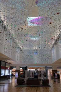 Wendy Hannah, Liberty - Herekoretanga (installation view Botany Town Centre) 31,872 recycled bottle camellia flowers commemorating 130 years of women