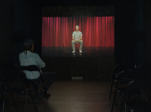 The Directors: Marcus, Marcus Coates, 2022 Installation view at Parnell Project Space, Tāmaki Makaurau, 2024.  Single channel HD video on loop, projection, 16 minutes and 51 seconds.  Photo by Sam Hartnett.